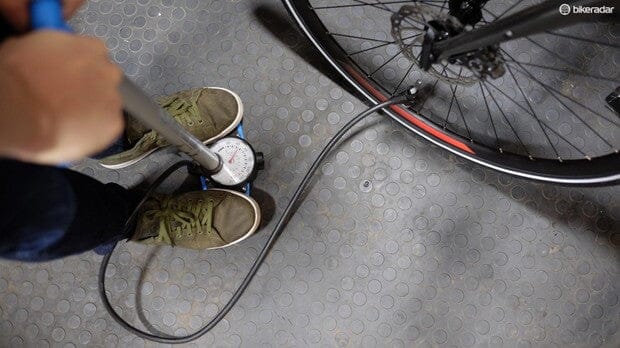 pumping up bicycle tyres